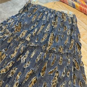 Stylish jeans material with animal print underneath serves as a slip but sewn